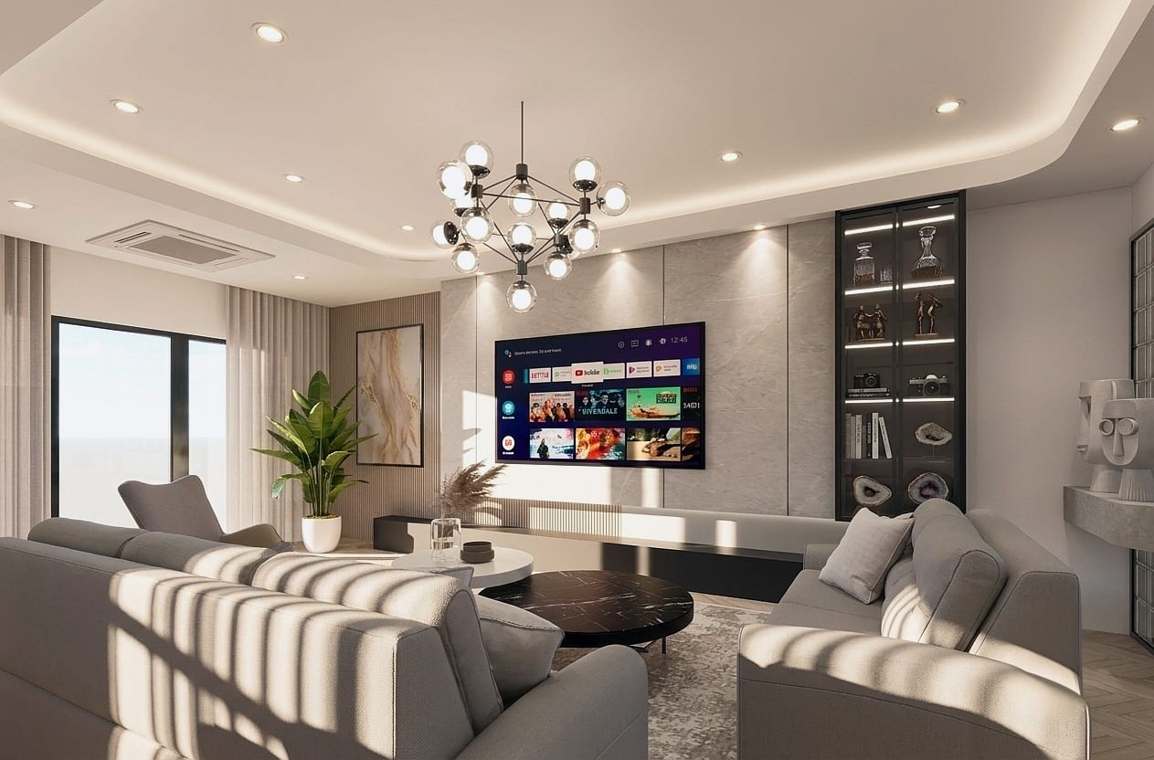 Ruang tamu dengan sofa melengkung, rak pameran dan lampu gantung untuk Serenia City Residence — visual reka bentuk